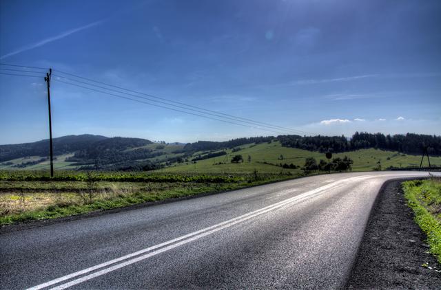 Blue sky, shiny road.